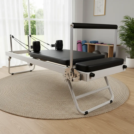 Foldable Pilates reformer in modern UK home studio - compact professional equipment for small spaces