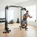 Male athlete using a cable crossover machine for tricep exercises inside a professional home gym setting.