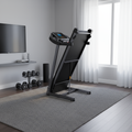 Pulserig folding treadmill folded for compact storage in living room