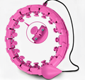 Pink smart hoop fitness equipment with adjustable design and weighted ball.