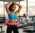 Woman exercising with pink smart fitness hoop in gym with text highlighting core training benefits