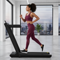 Woman exercising on PulseRig folding treadmill at home - Perfect for UK home fitness routines